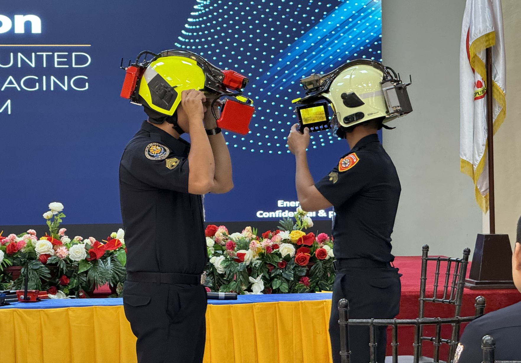Philippines firefighters trying on the helmets with iFalconHM system 