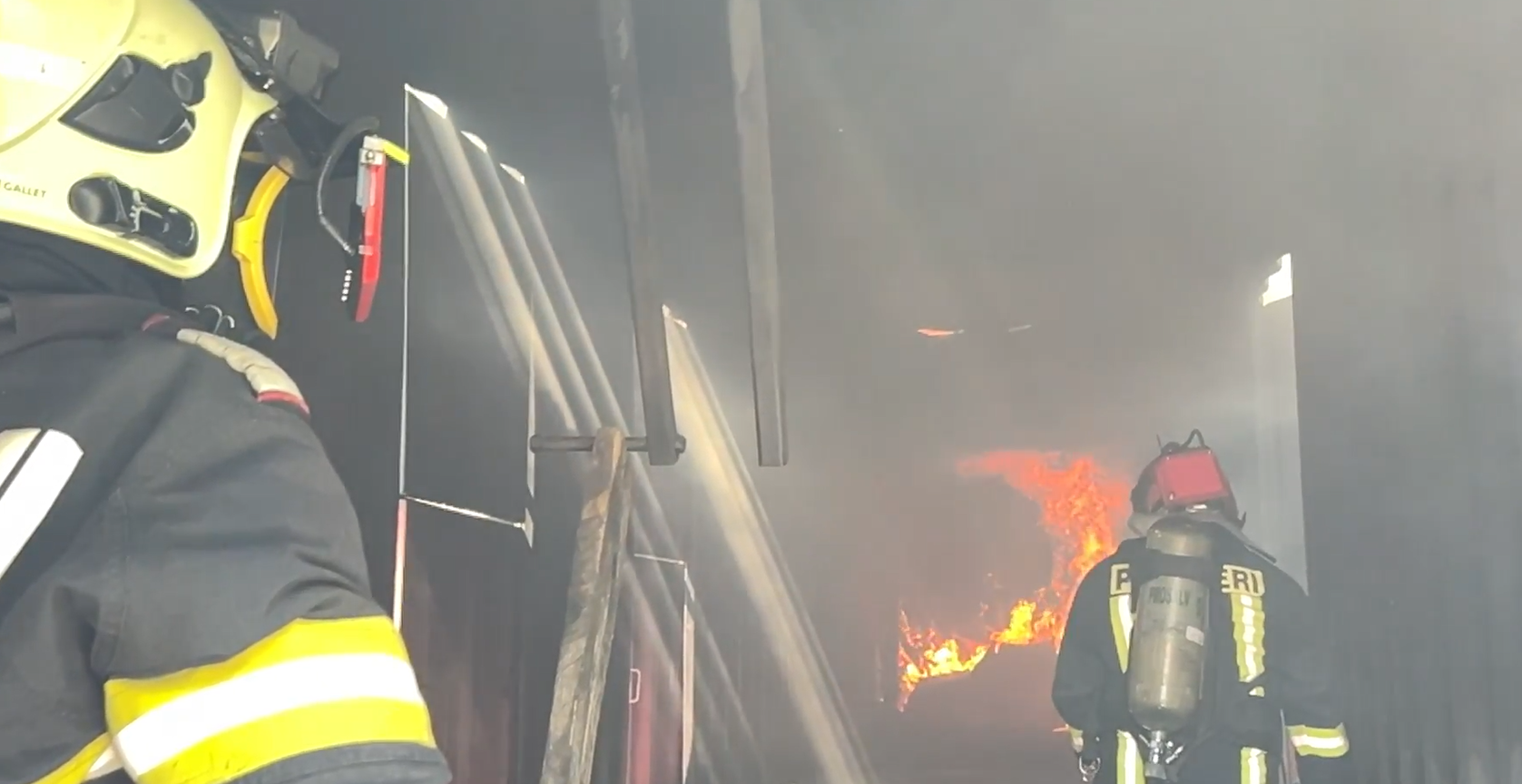 Romanian firefighters testing iFalconHM in a container with fire